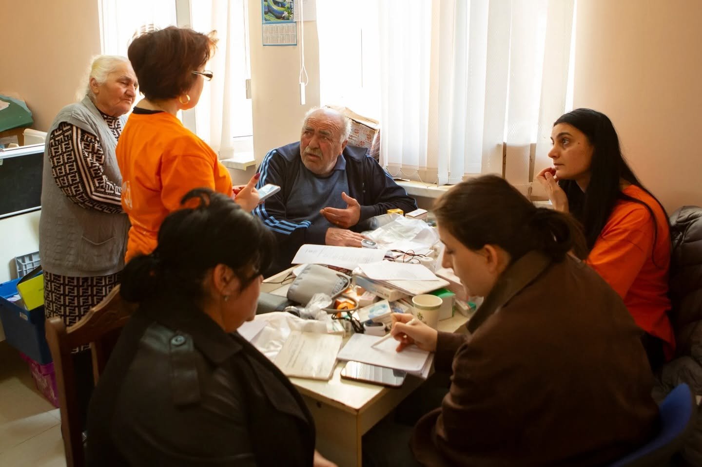 VIVA volunteers registering patients during a community healthcare visit in Armenia