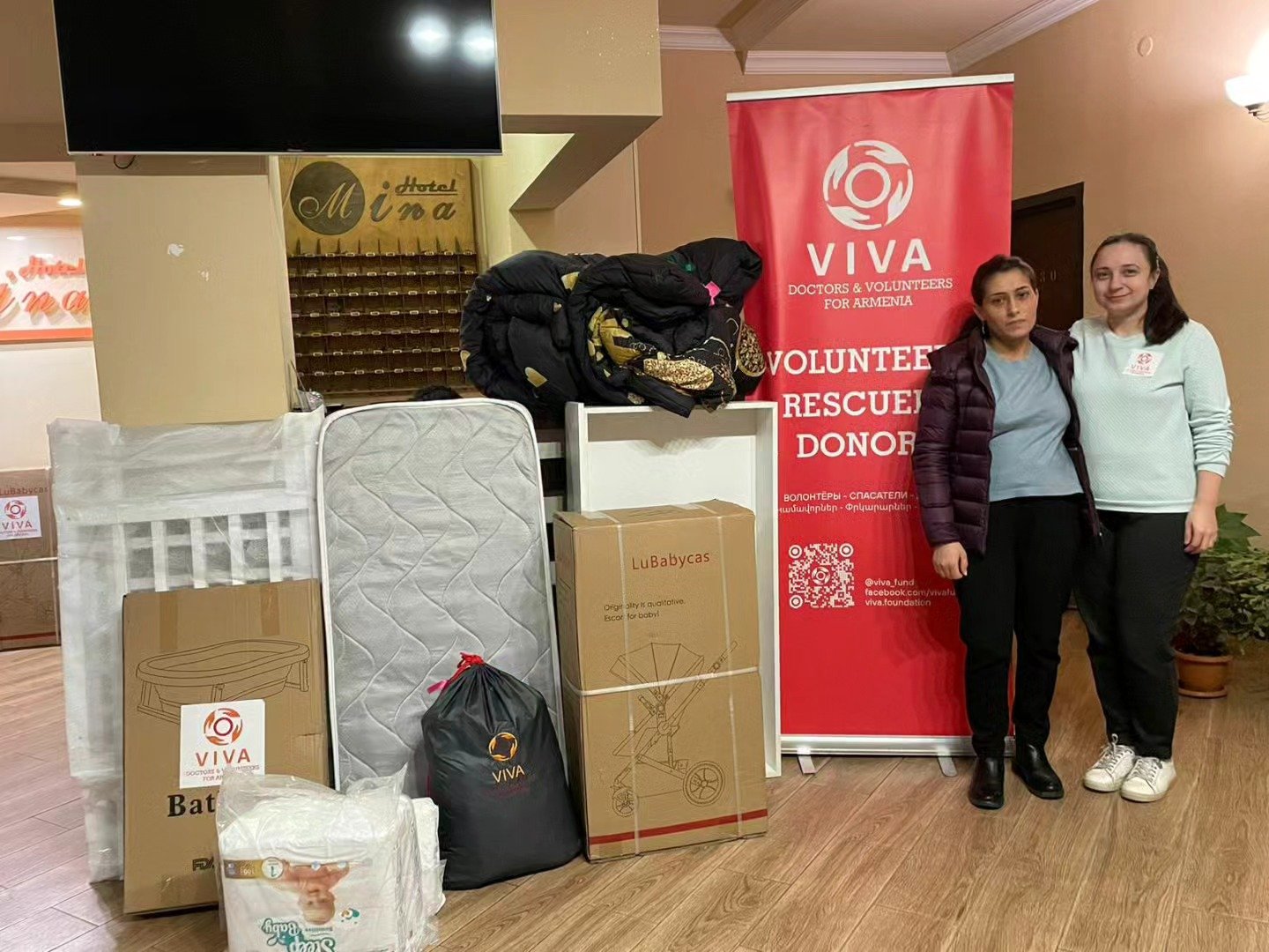 VIVA Foundation volunteer delivering maternity and newborn supplies to a mother from Artsakh
